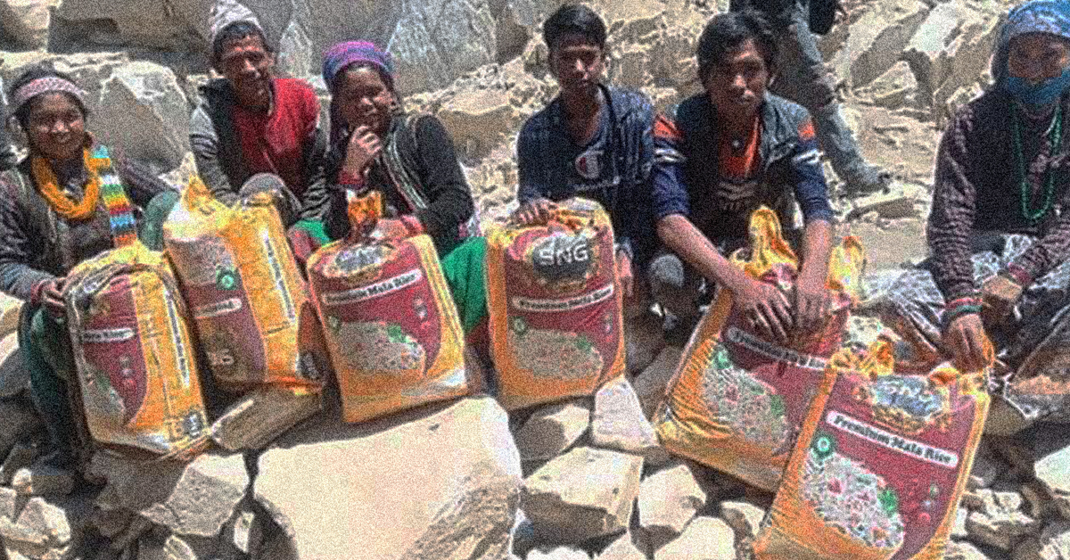 Nepalese family with food supplies