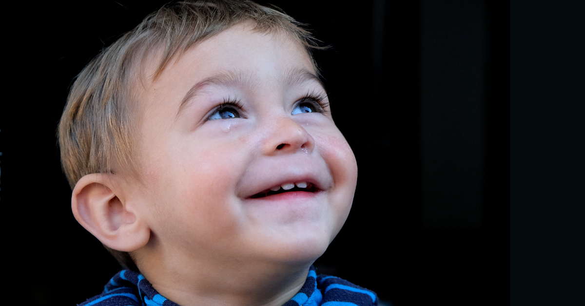Close-up portrait of Haris smiling