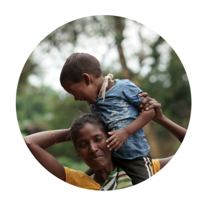 A mother with her son on her shoulders