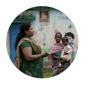 One of our local support workers speaking to a woman with a child