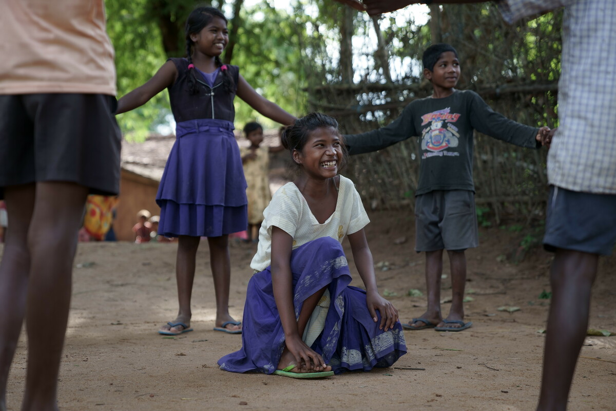 Sonia, one of the children we have helped, playing with her friends